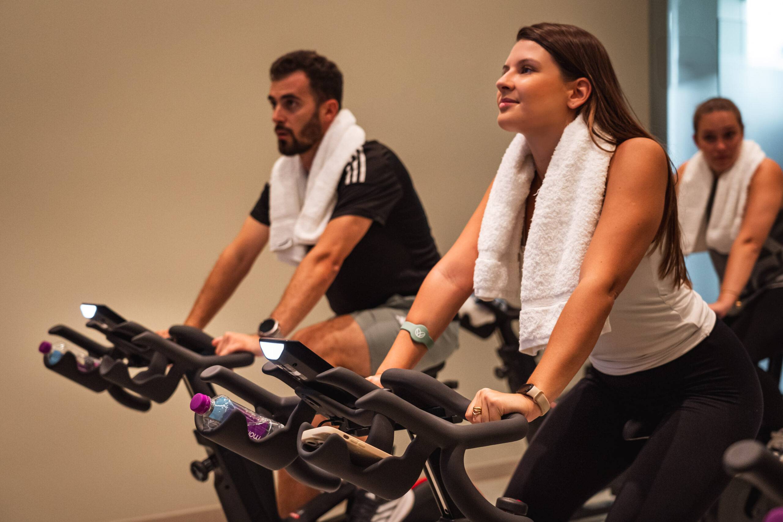 a man and woman having a cycling group class in algarve