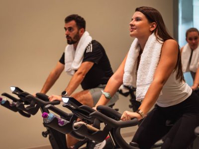 a man and woman having a cycling group class in algarve